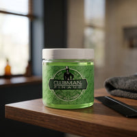 Ed. Pinaud Light Hold Pomade - pot op blad naast kam en handdoek bij het raam